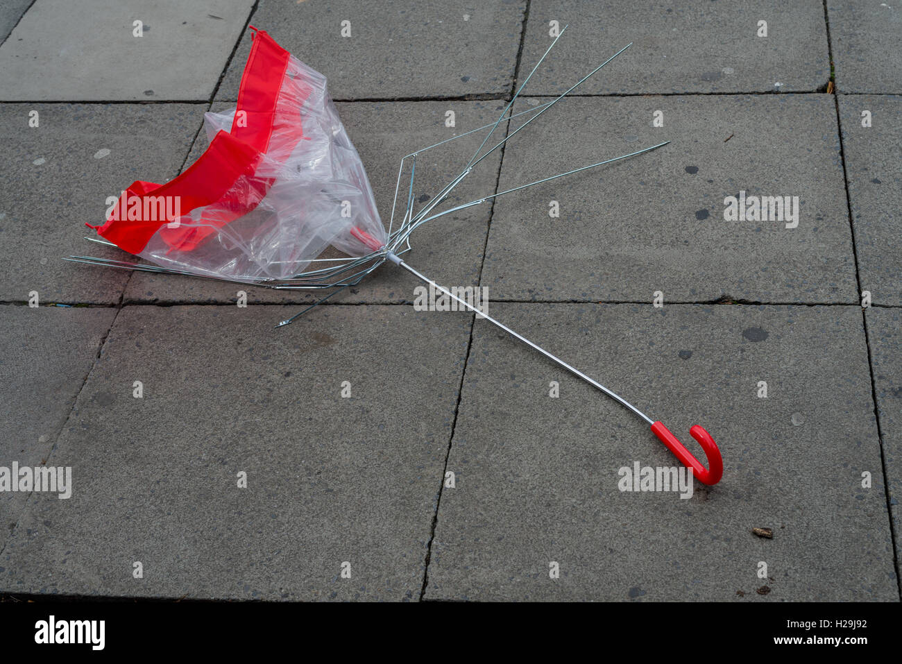 Broken red umbrella Stock Photo