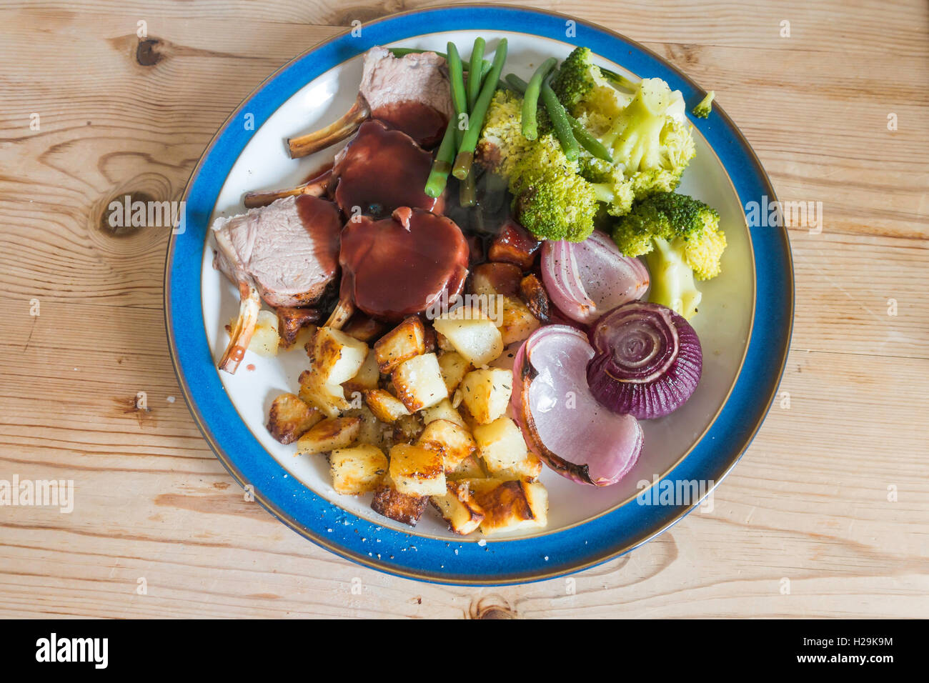 English dinner Roast rack of lamb broccoli onion and gravy served on a