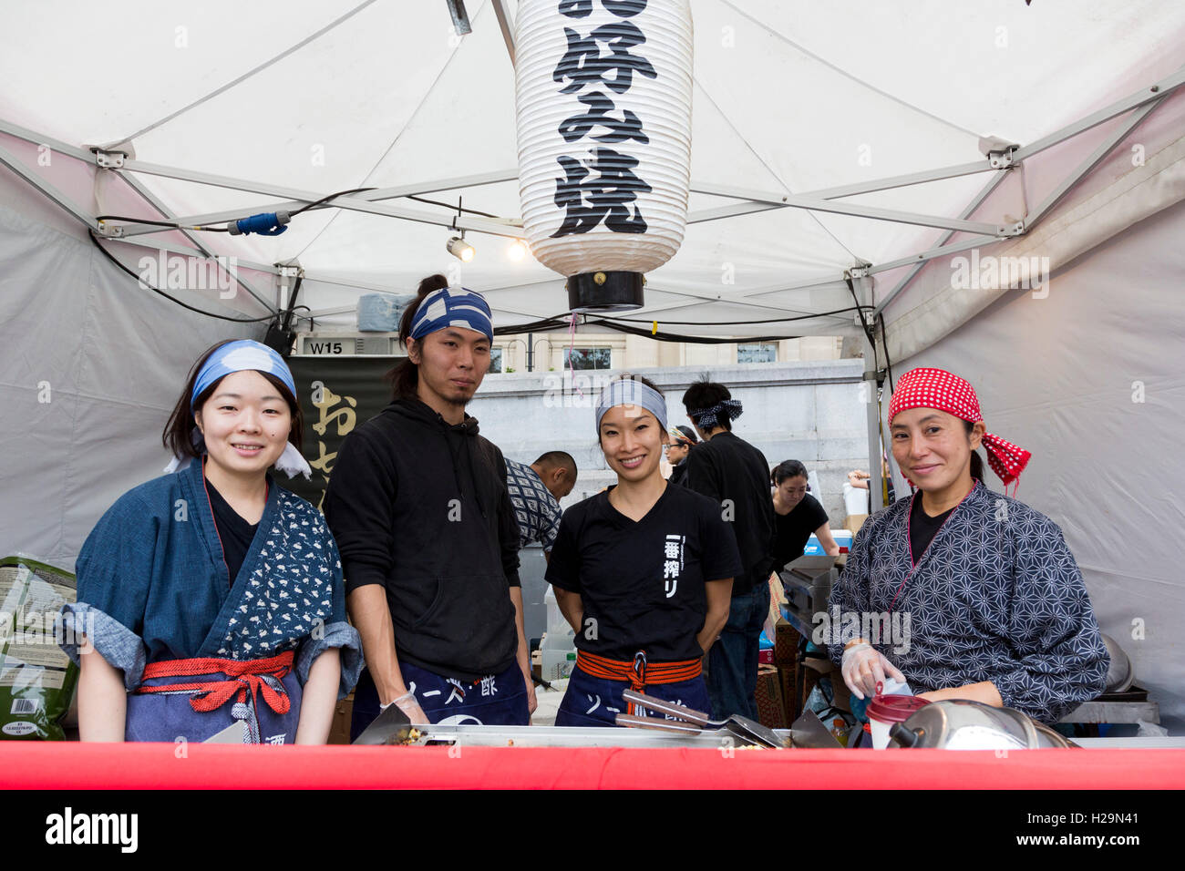 London, UK. 25 September 2016. Pictured: chefs at food stalls. London celebrates Japan Matsuri 2016. The festival, now in its 8th year, brings people together to enjoy a day of Japanese food, music, dance and culture in Trafalgar Square. Credit:  Bettina Strenske/Alamy Live News Stock Photo