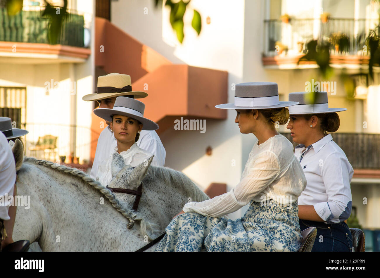 Girls on horses in traditional flamenco dress at Romeria of Fuengirola, religious pilgrimage one week before the annual fair, Fuengirola, Andalusia, Spain. 25 september, 2016.  Feria Credit:  Perry van Munster/ Alamy Live News Stock Photo