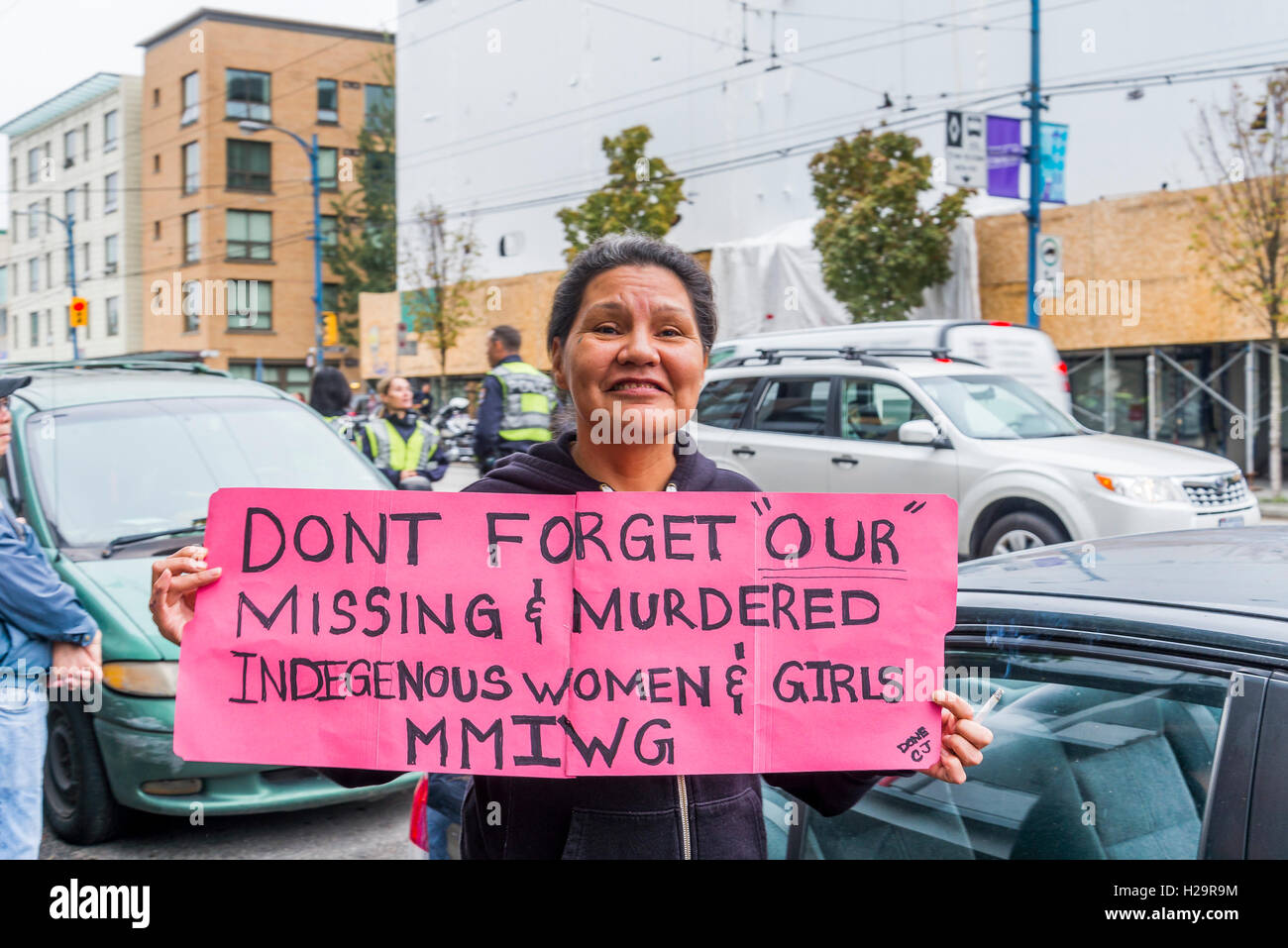 First Nations woman with sign of remembrance for downtown eastside murdered and missing women upon the the arrival of Prince William and the Duchess of Cambridge, at Sheway, in the Downtown Eastside, Vancouver, British Columbia, Canada Credit:  Michael Wheatley Alamy Live News. Stock Photo