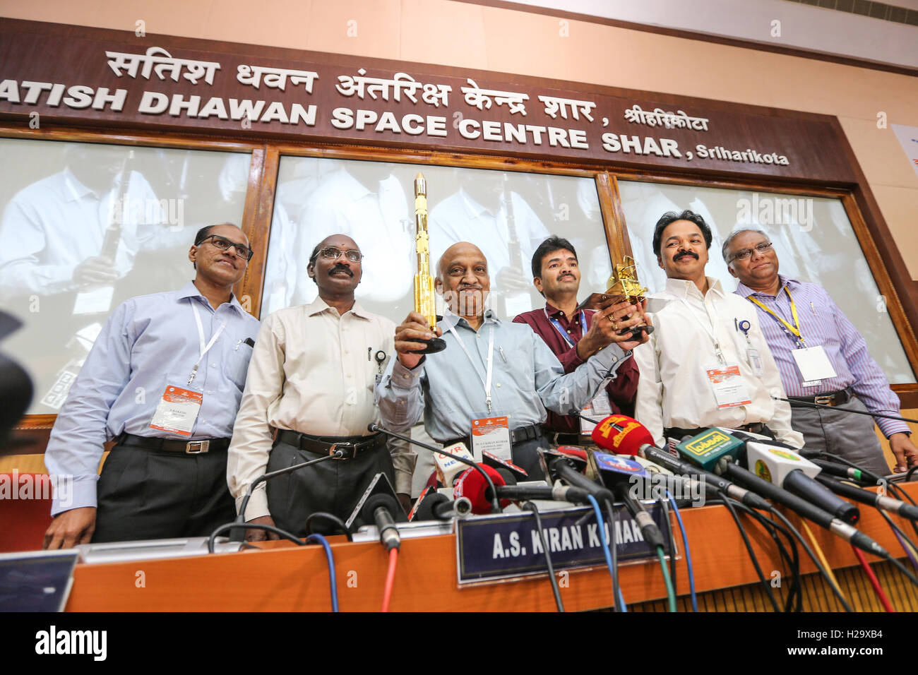 Sriharikota, India. 26th Sep, 2016. Dr. A.S. Kiran Kumar Reddy holdong the miniature Rocket and the SCATSAT-1 on his hands PSLV C-35, carrying India's SCATSAT-1 meant for ocean and weather studies and seven other satellites including from the US and Canada, after successfully lifted off from the spaceport. Credit:  SUKUMAR S/Alamy Live News Stock Photo