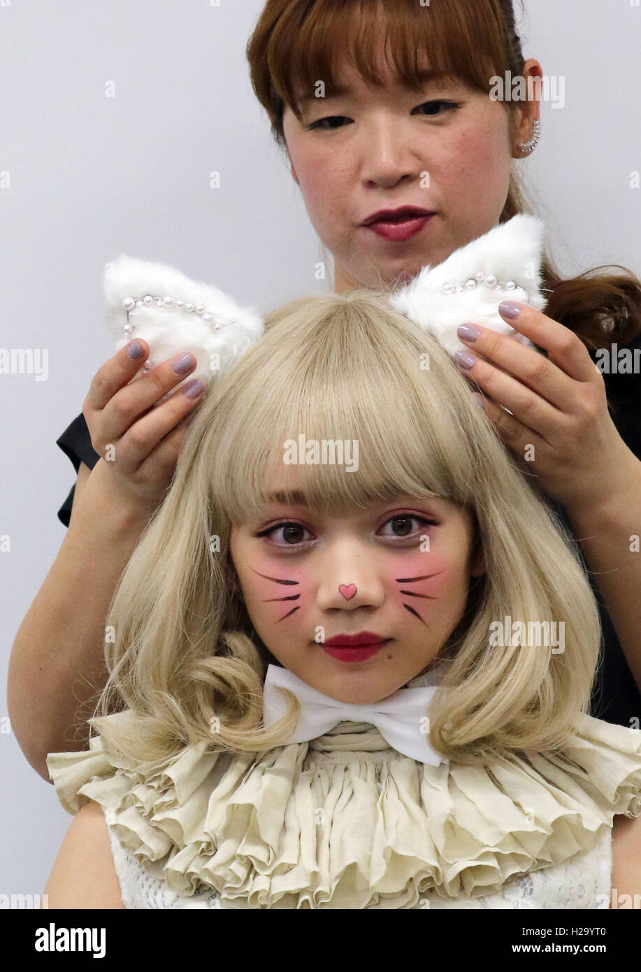 Tokyo, Japan. 26th Sep, 2016. A model displays a cat make-up, presented by Shiseido's senior hair and make-up artist Sawako Yuri for the Halloween event at the company's office in Tokyo on Monday, September 26, 2016. Yuri demonstrated her skill of kawaii make-up of white and black cats. Credit:  Yoshio Tsunoda/AFLO/Alamy Live News Stock Photo