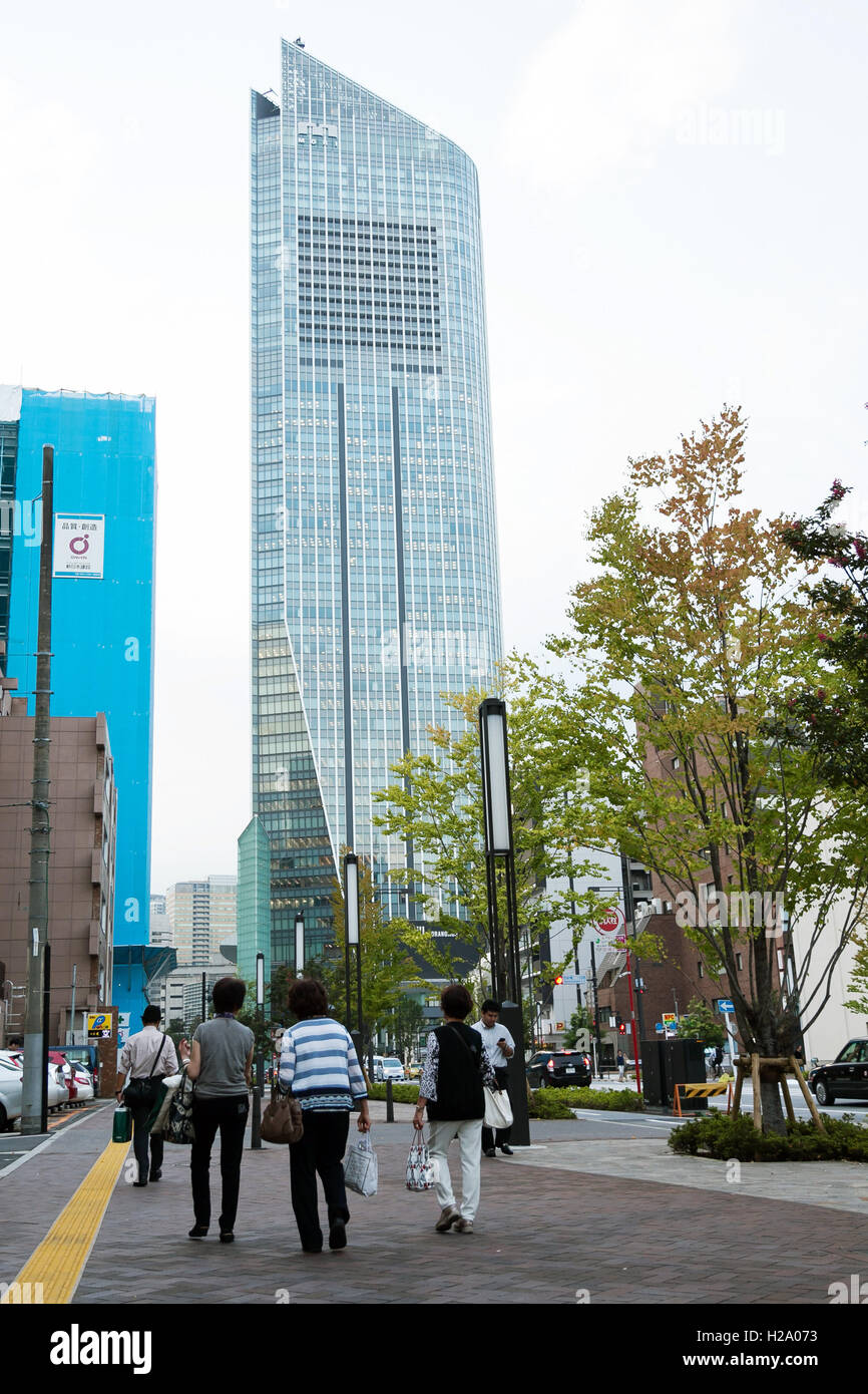 Pedestrians walk along newly opened section of Loop Road No. 2 between Shimbashi and Toranomon on September 26, 2016, Tokyo, Japan. When complete the new road will connect the Shimbashi station area with the government buildings and offices of Toranomon Hills. The boulevard is wide by Tokyo standards including 13m sidewalks and bike lanes and it is hoped that the area will attract many foreign visitors especially during the 2020 Olympic Games. © Rodrigo Reyes Marin/AFLO/Alamy Live News Stock Photo