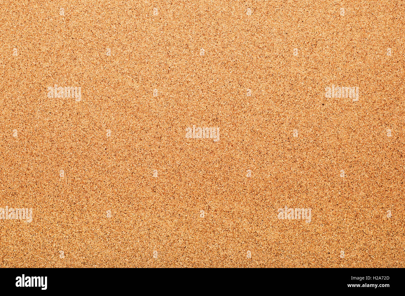 Brown textured cork board closeup background Stock Photo