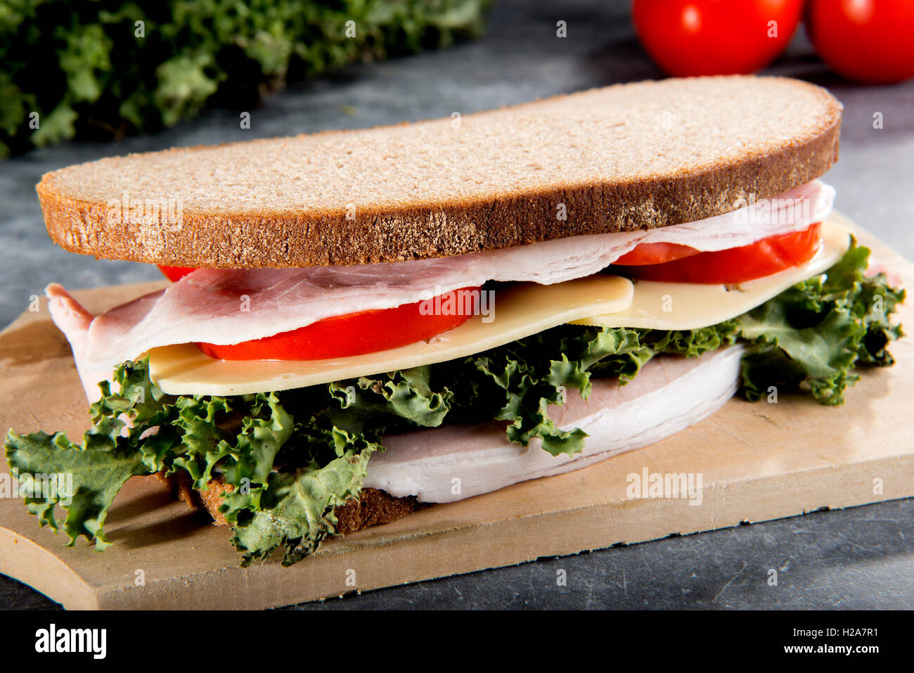 Fresh sandwich with ham tomato lettuce cheese Stock Photo