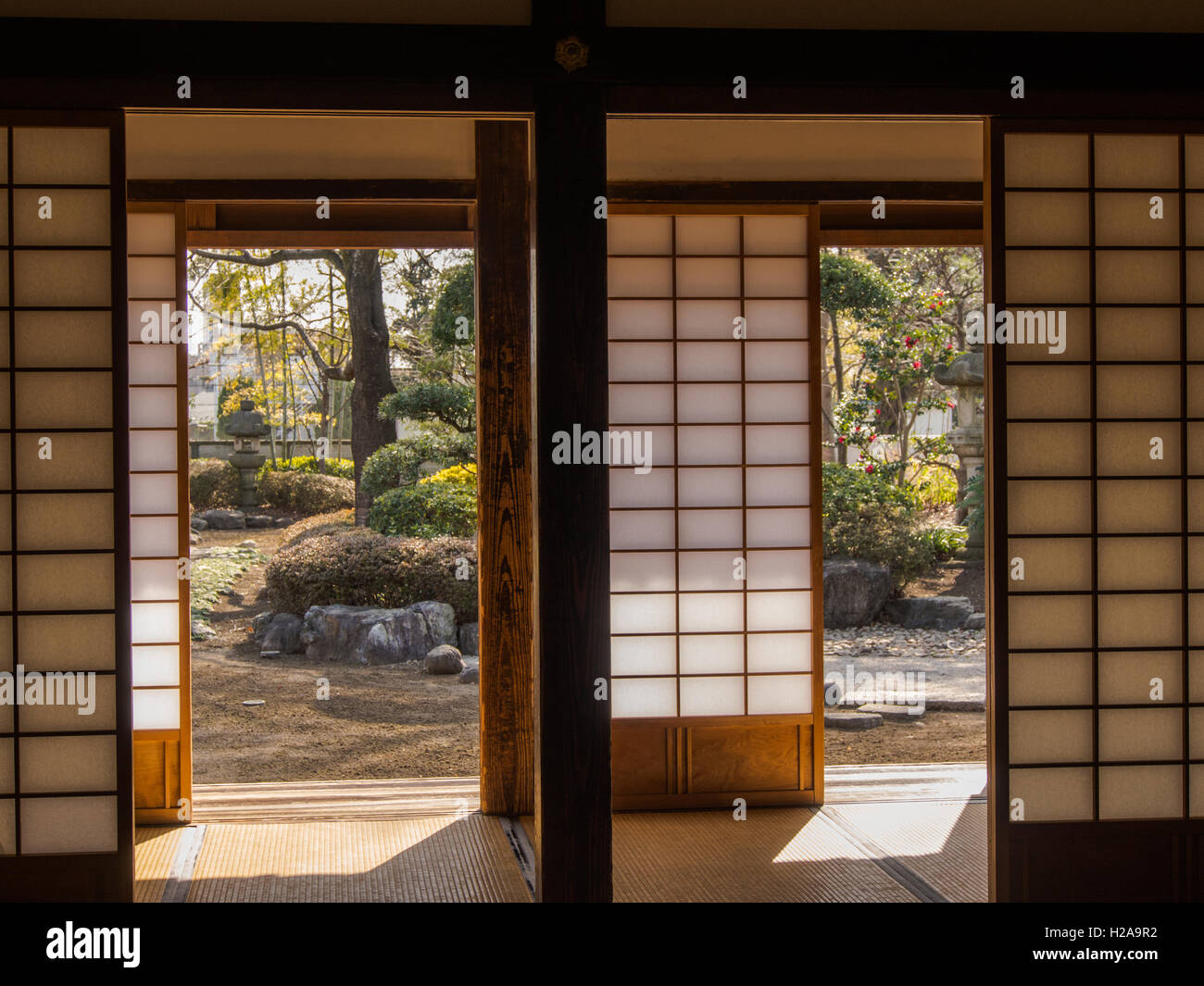 Traditional Japanese architecture. Looking from room with  tatami mats and shoji screens to view of traditional garden.  Kawagoe Stock Photo