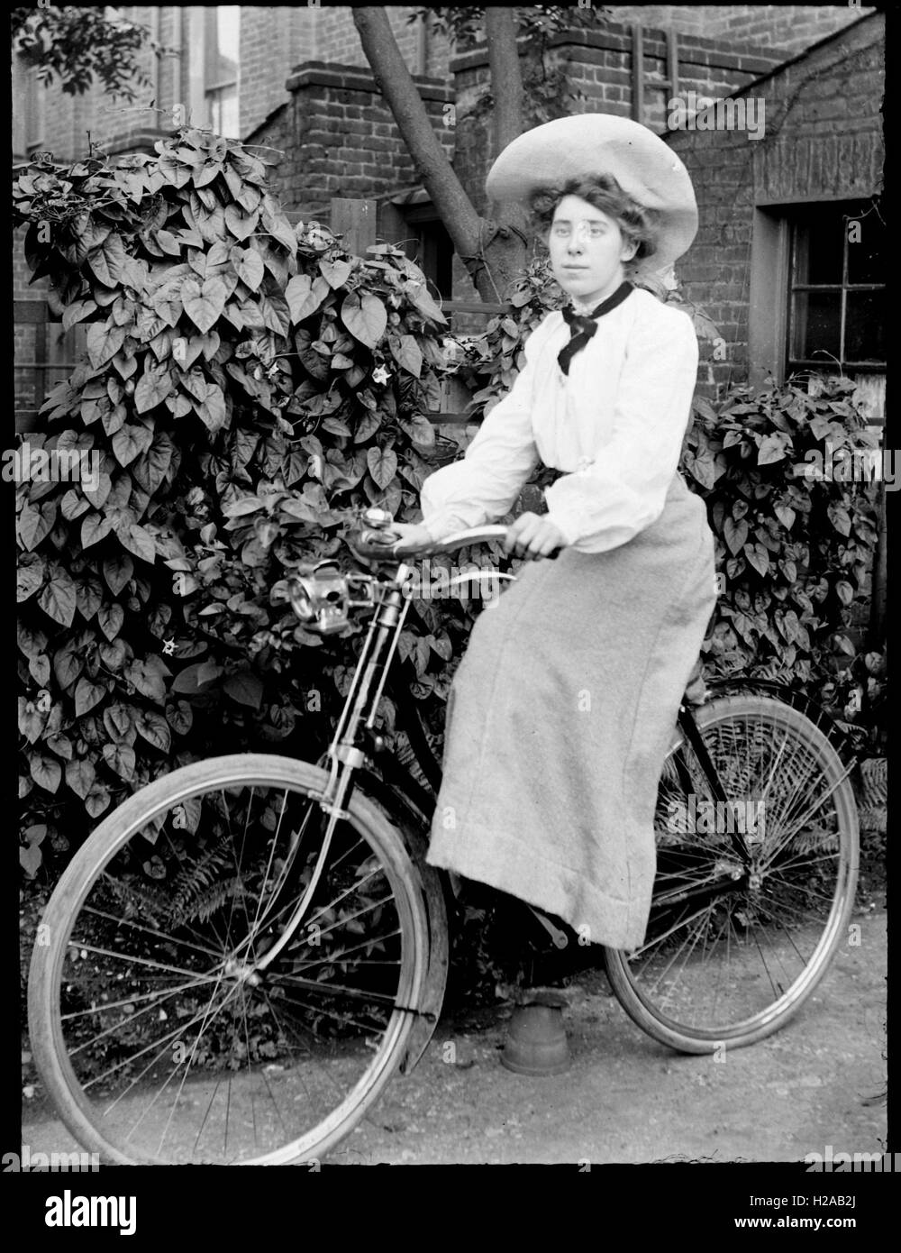 Woman on bicycle c1910. Photo by Tony Henshaw Stock Photo
