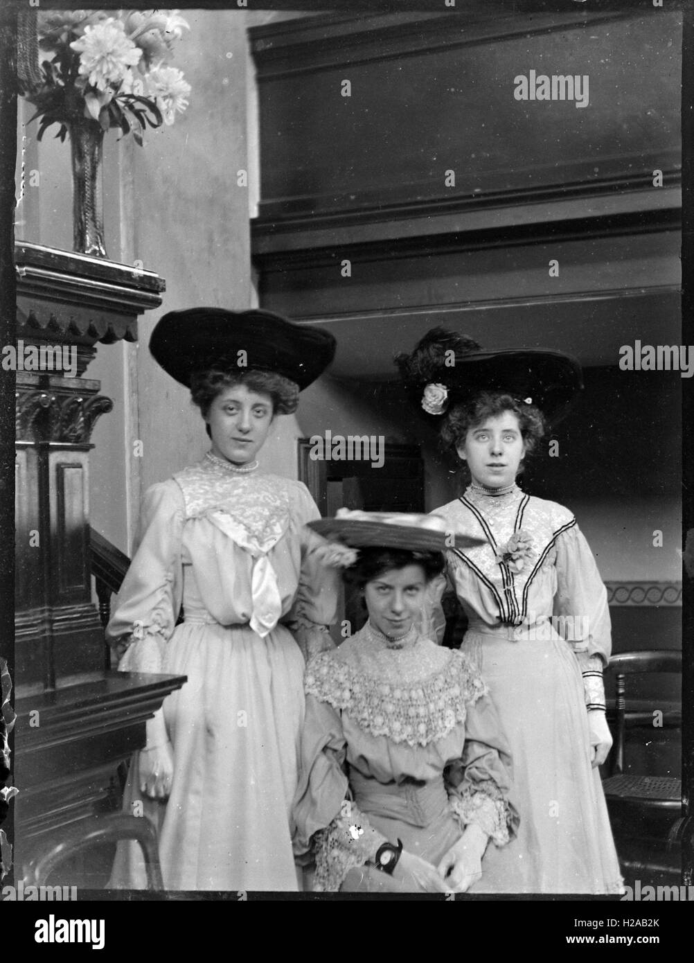 Young ladies in dresses and hats c1900. Photo by Tony Henshaw Stock Photo