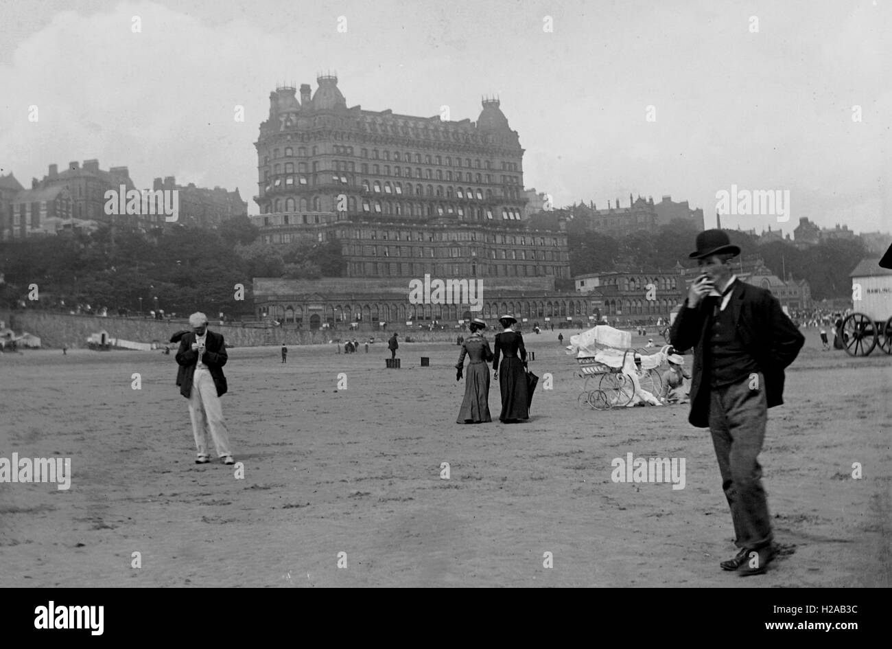 Beach scene including The Grand Hotel, South Bay, Scarborough, Yorkshire c1910.  Photo by Tony Henshaw Stock Photo