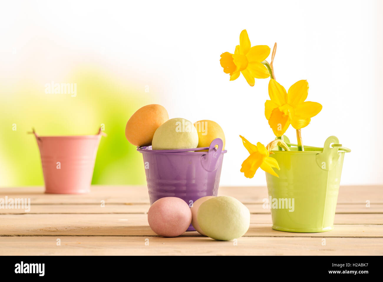 Easter eggs in a purple bucket in the easter Stock Photo - Alamy