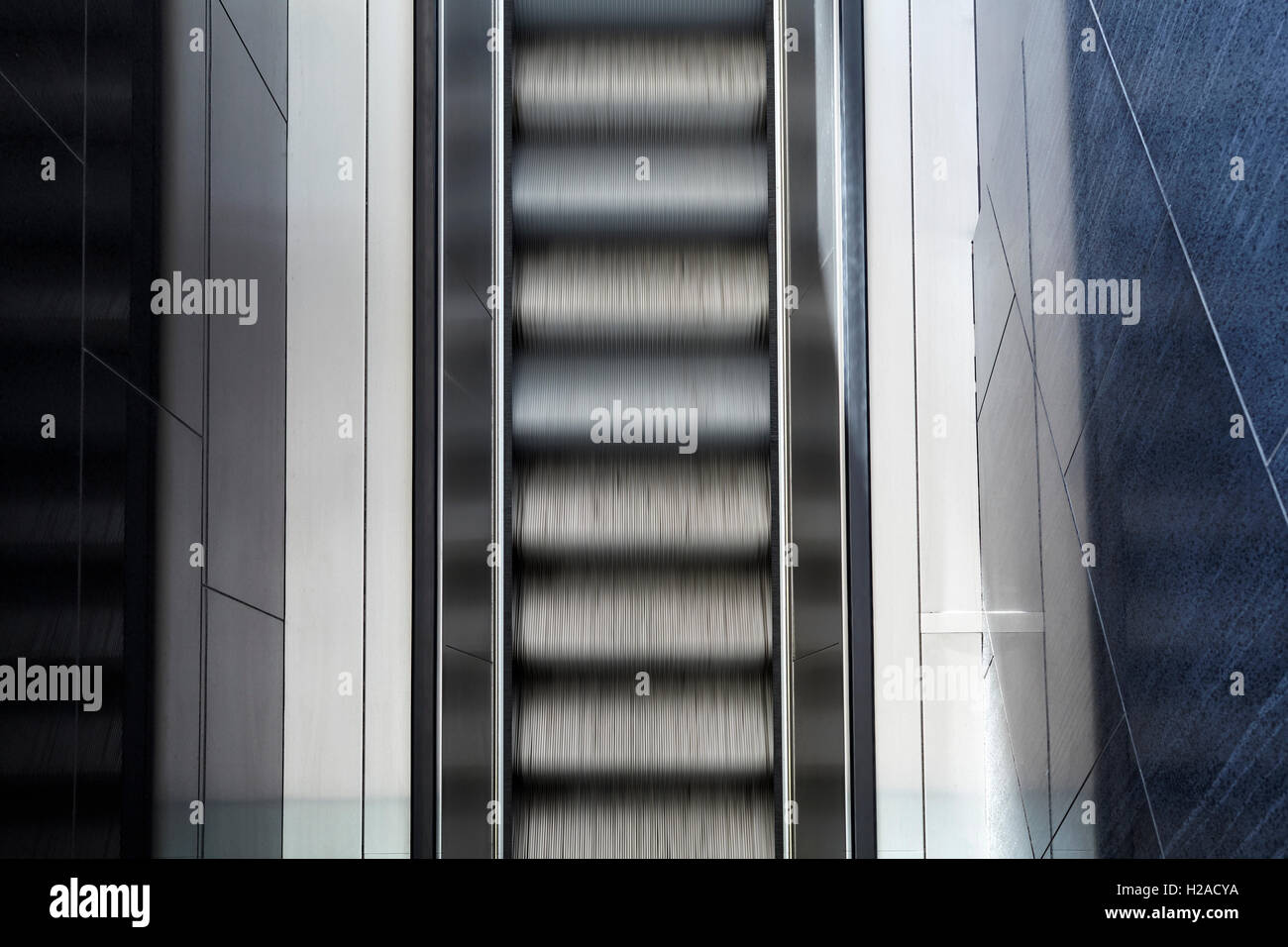 Top view of motion blurred empty escalator, abstract modern background. Stock Photo