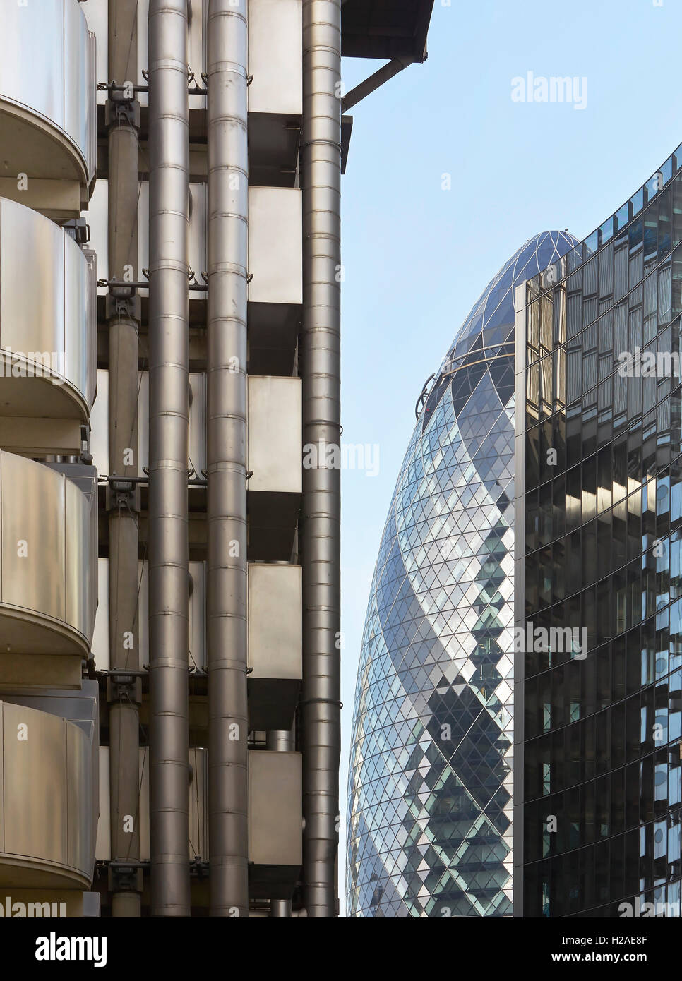Iconic facades juxtaposed. The Gherkin, London, United Kingdom. Architect: Foster + Partners, 2004. Stock Photo