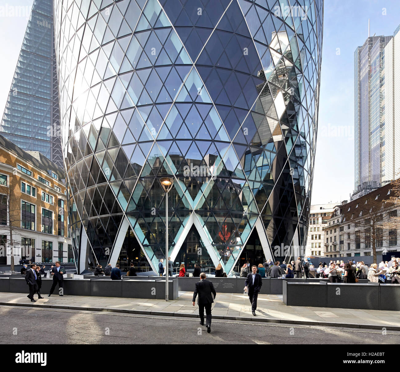 Base of building and context. The Gherkin, London, United Kingdom. Architect: Foster + Partners, 2004. Stock Photo
