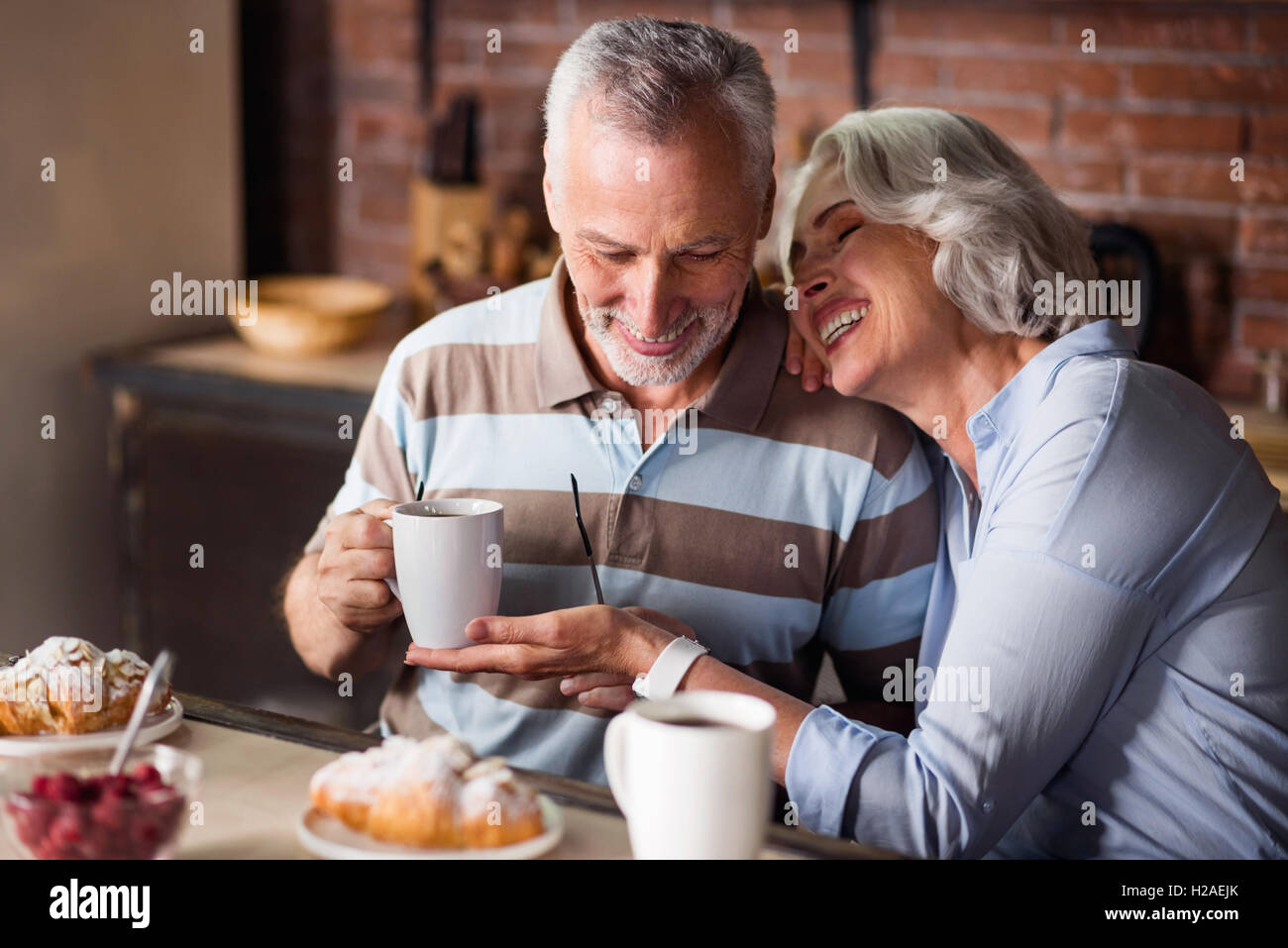 Retired Couple Sitting Outdoors At Home Having Morning Coffee Together  Stock Photo - Download Image Now - iStock