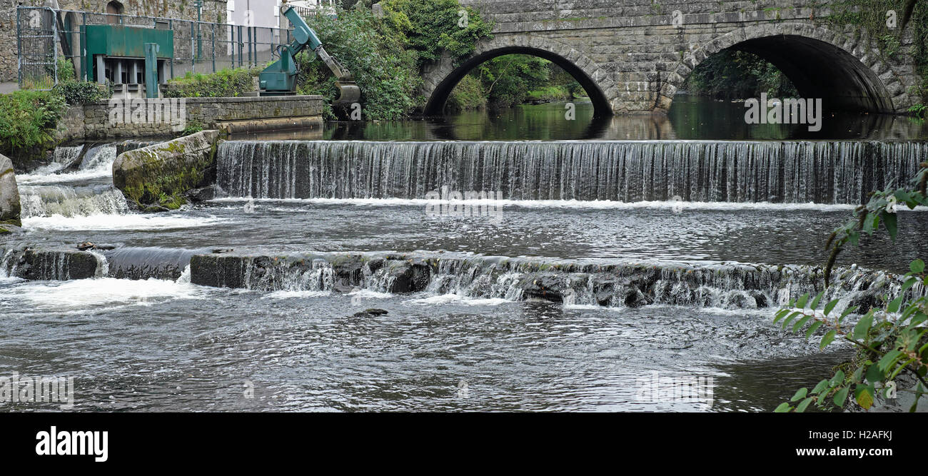 The river Tavy coursing over a weir outside Tavistock in Devon, England Stock Photo