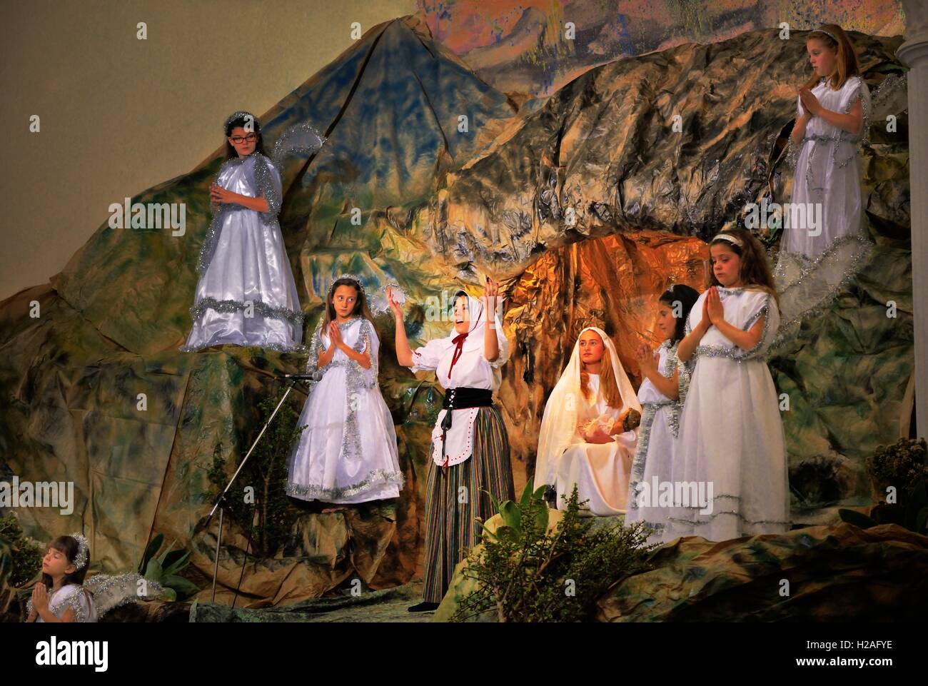 Teguise, Lanzarote. Young village girls in traditional Christmas church nativity in the Iglesia de Nuestra Señora de Guadalupe Stock Photo