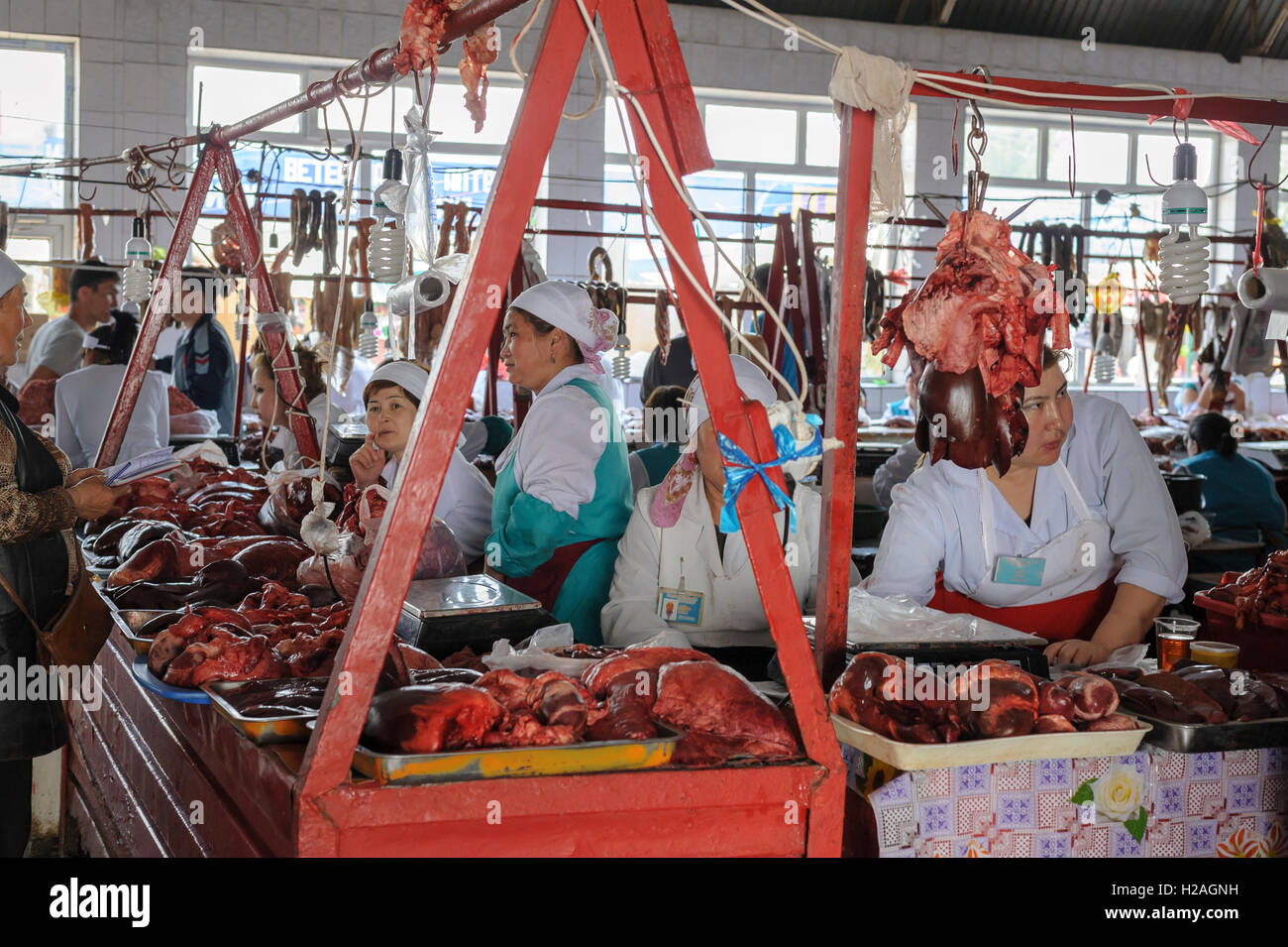Women selling meat in a traditional souq of Almaty, Kazakhstan, Central Asia Stock Photo
