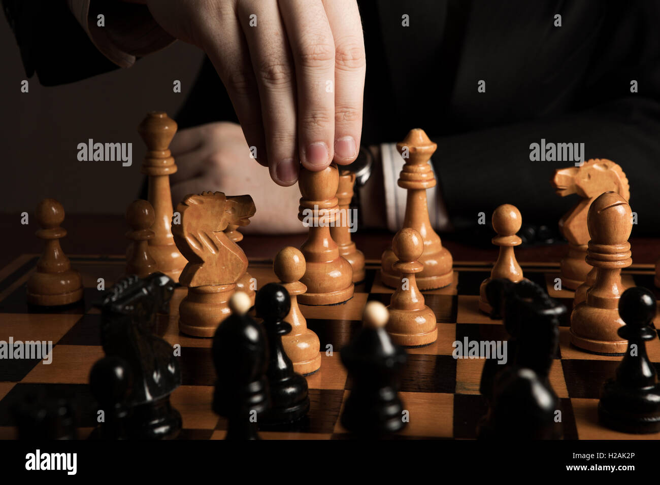 Making A Move Chess man makes a move chess figure Stock Photo - Alamy