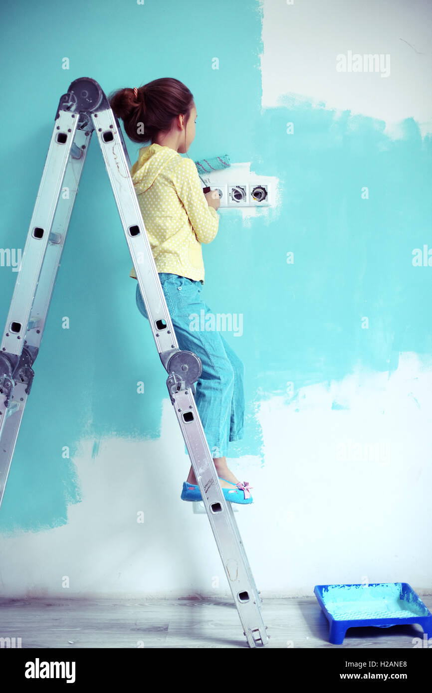 Child painting the wall Stock Photo Alamy