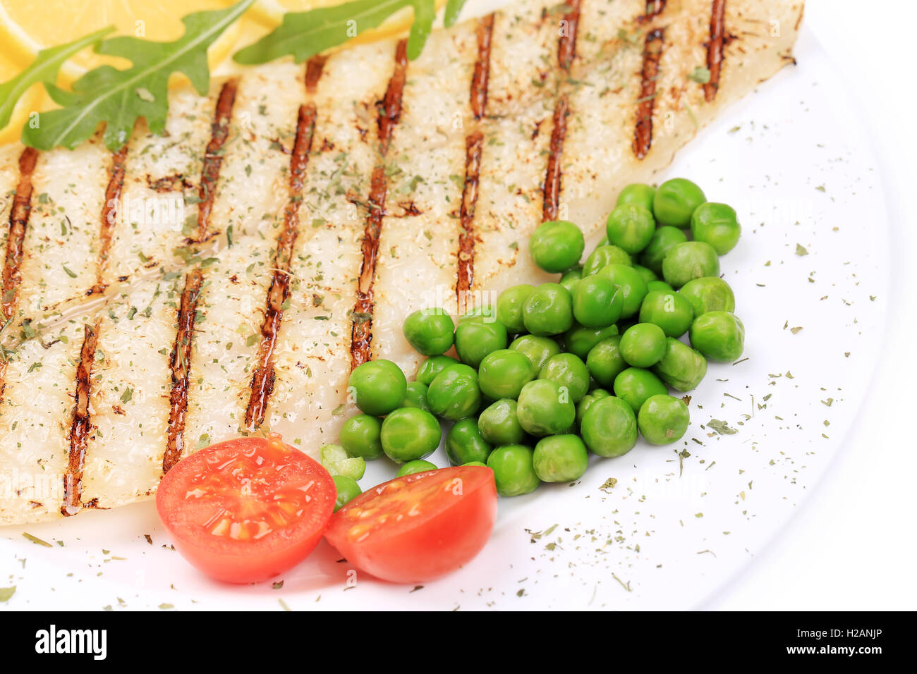 Fried fish fillet with vegetables Stock Photo - Alamy