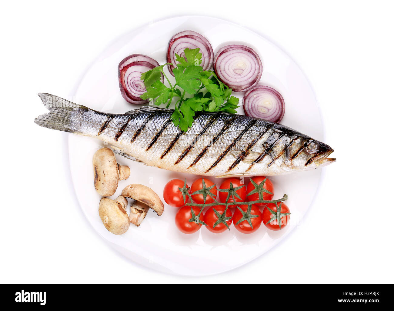 Grilled fish with vegetables Stock Photo - Alamy