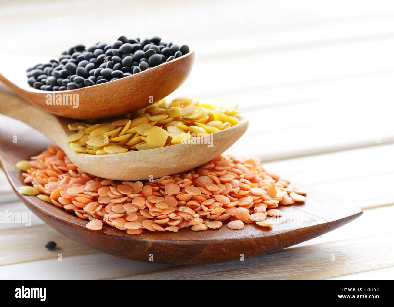different varieties of lentils, red, yellow and black Stock Photo - Alamy