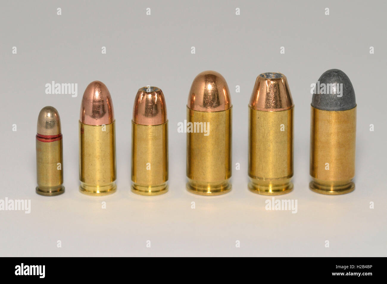 Row of pistol ammunition, different calibers Stock Photo