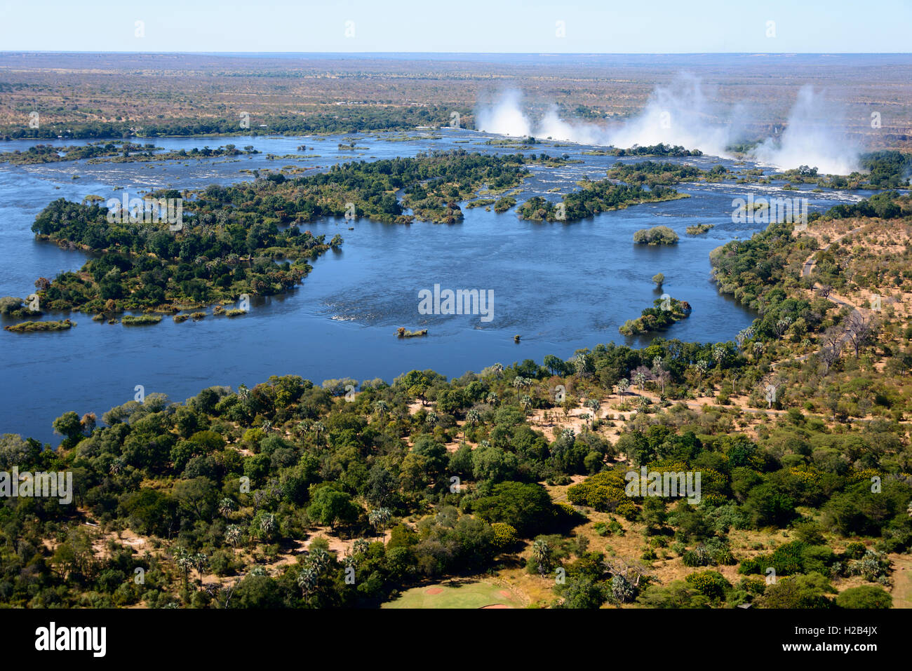 Aerial View, Zambezi river flows into the Victoria Falls, border of