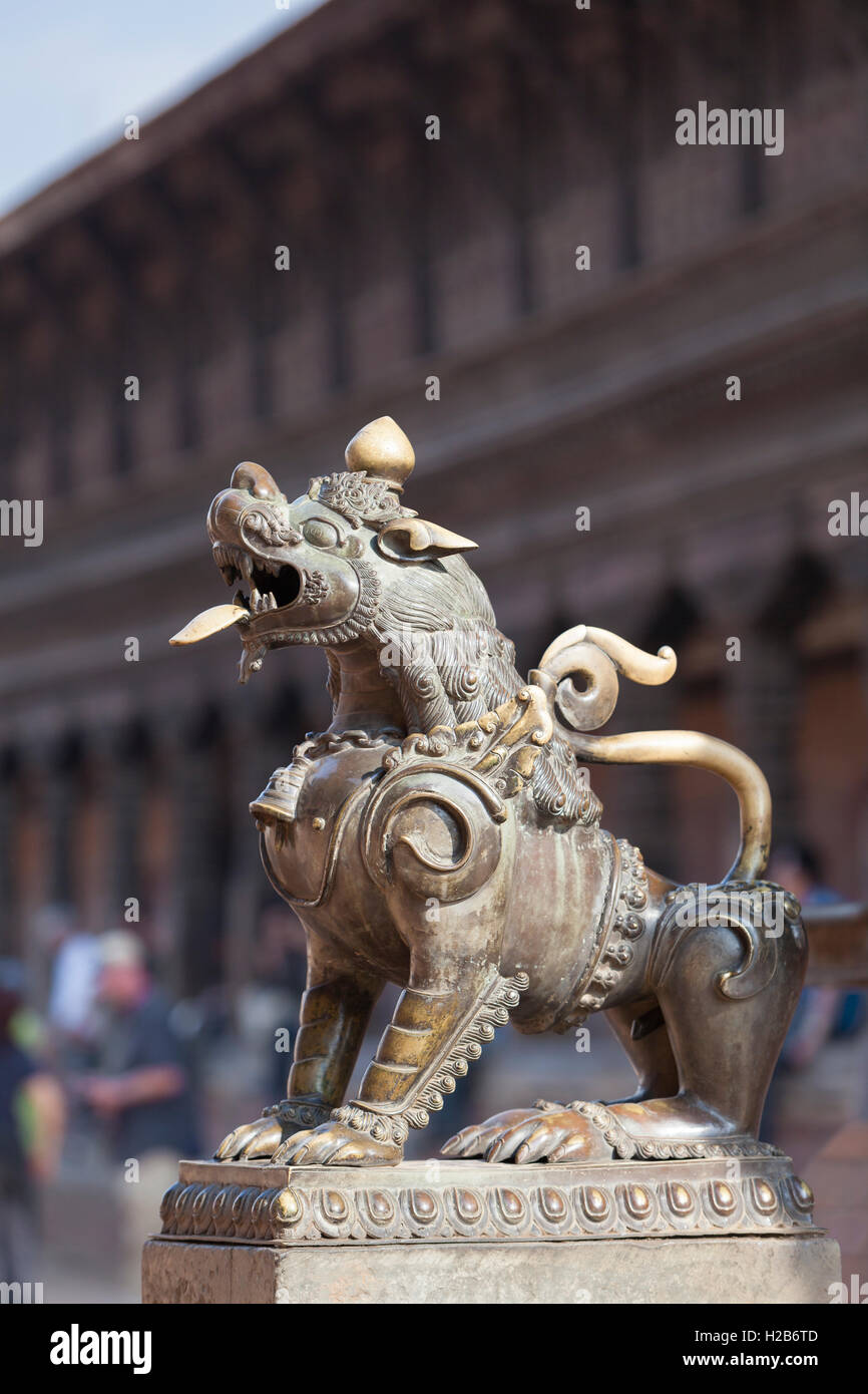 Lion statue outside Vatsala Durga temple, Durbar Square, Bhaktapur, Nepal Stock Photo