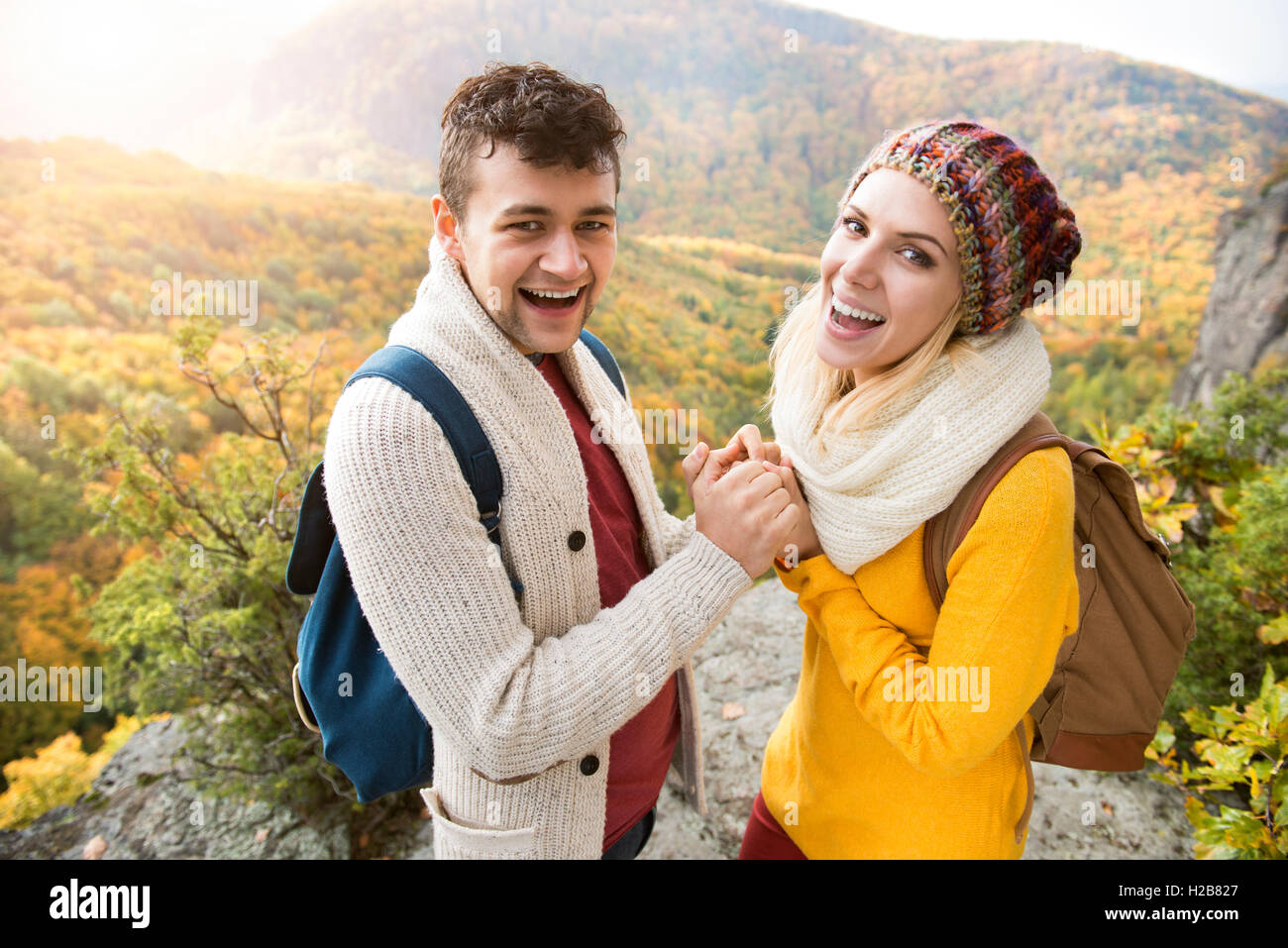Beautiful couple in autumn nature against colorful autumn forest Stock ...