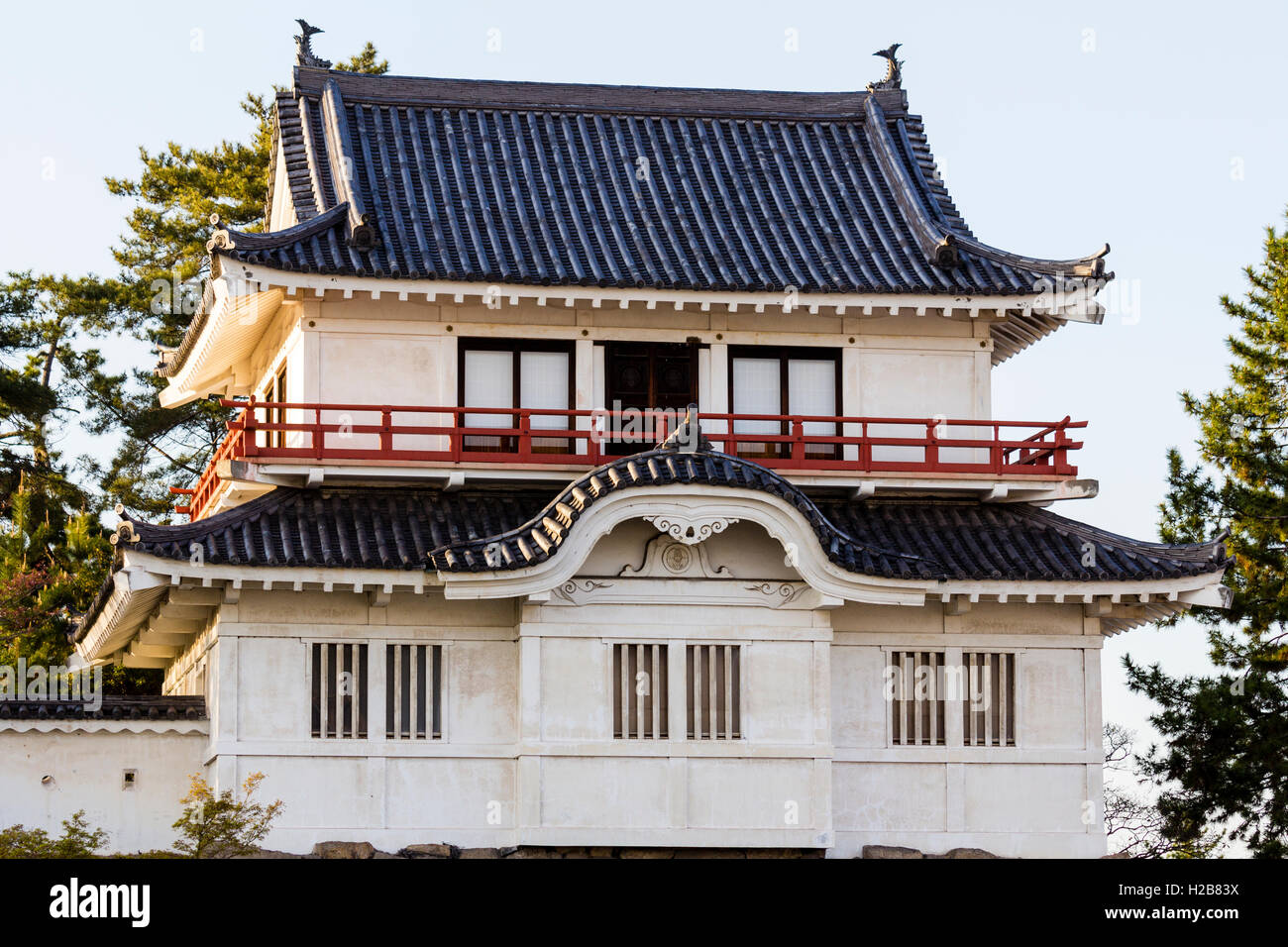 Fukuyama castle in Japan. The corner two story Tsukimi yagura, or 'moon-viewing' turret, located on the inner castle wall. Golden hour. Stock Photo