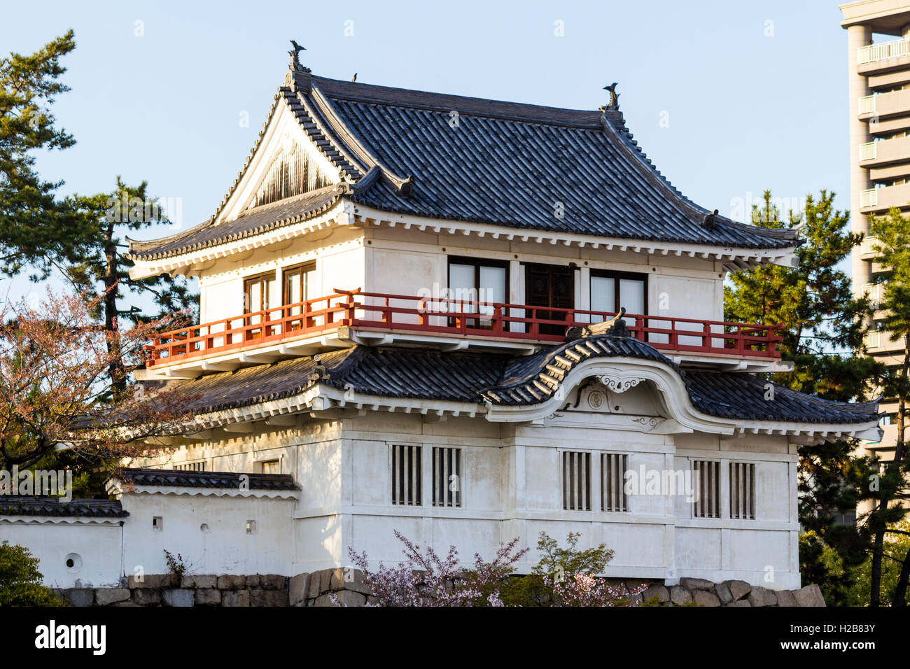 Fukuyama castle in Japan. The corner two story Tsukimi yagura, or 'moon-viewing' turret, located on the inner castle wall. Golden hour. Stock Photo