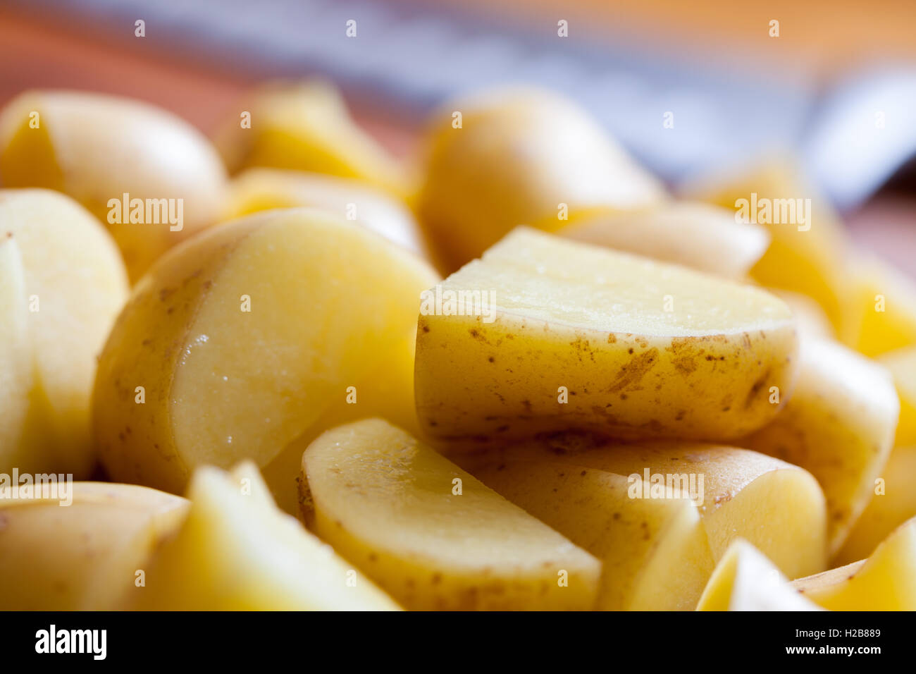 New potatoes sliced and ready Stock Photo Alamy