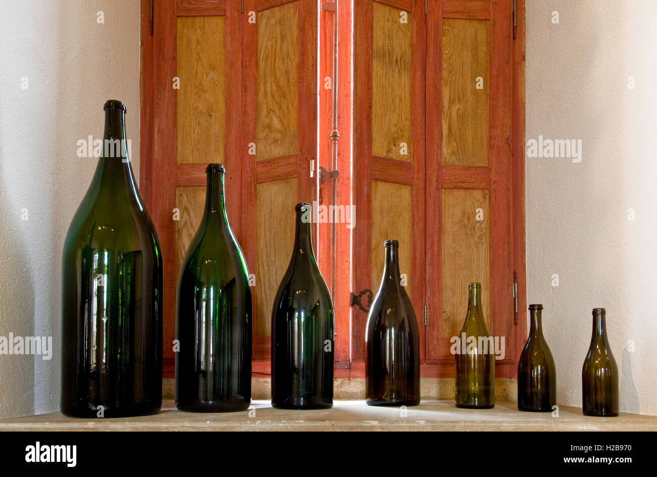 Wine bottle bottles sizes variety line on display in the tasting room of Chateau de Pommard Cote d'Or Burgundy France Stock Photo