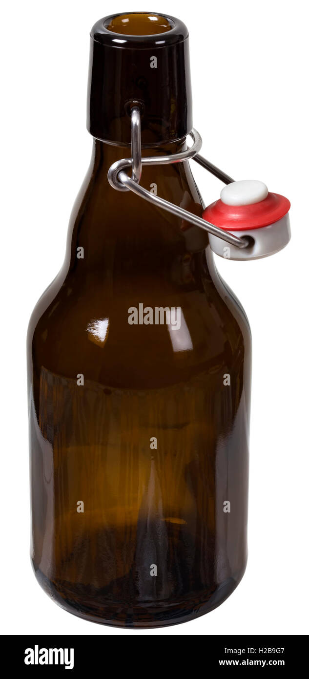 Empty glass bottle with the open cap hold with metal wire isolated over the white background. Clipping path included. The image Stock Photo
