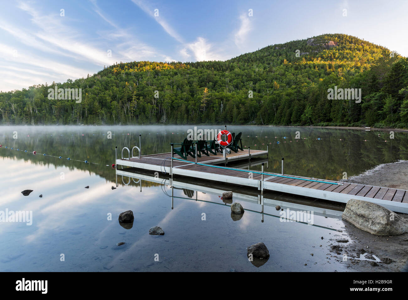Mount Jo rises over the Heart Lake dock on a misty morning in the High Peaks region of the Adirondacks near Lake Placid, NY Stock Photo