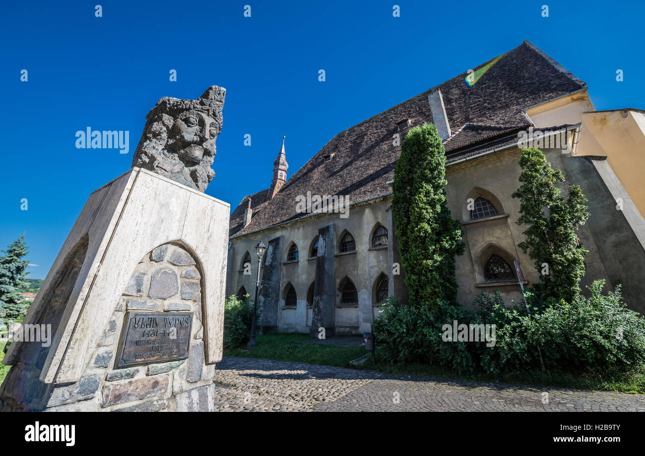 Vlad the Impaler (Vlad Dracula) bust in front of Church of the Dominican Monastery in Historic Centre of Sighisoara, Romania Stock Photo