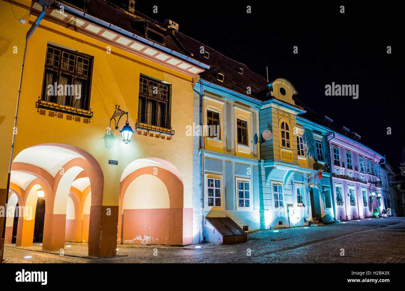 Tenement houses at Citadel's Square in Historic Centre of Sighisoara city, Transylvania region in Romania Stock Photo