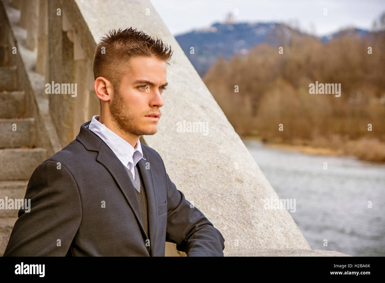 Handsome young man outdoor wearing jacket and shirt standing by ...