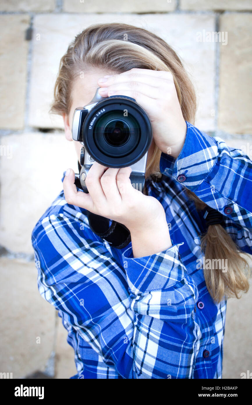 Teenager with camera Stock Photo