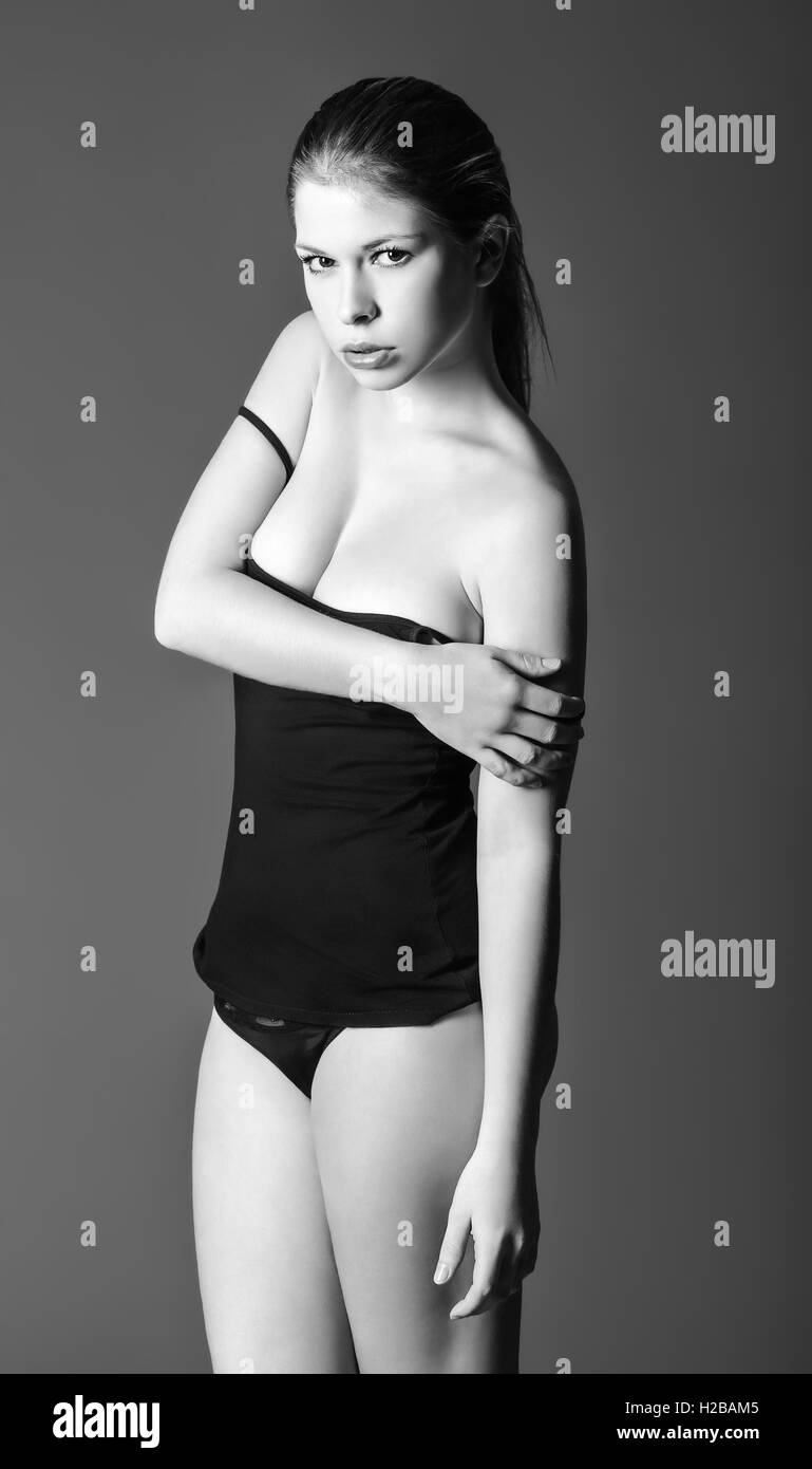 Studio portrait of sexy beautiful girl wearing shirt and panties Stock  Photo - Alamy