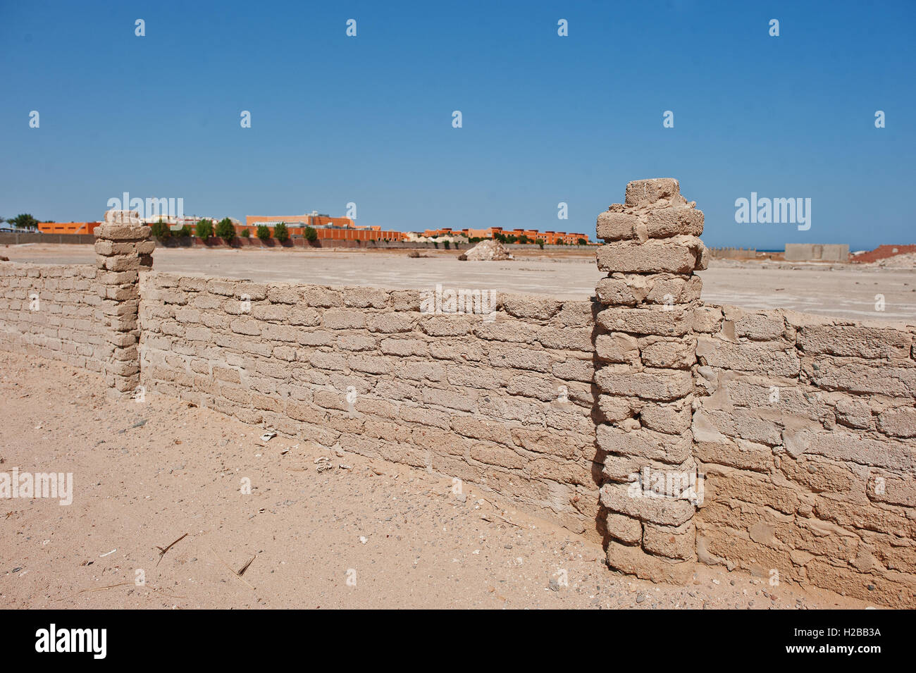 Brick fence wall at sand on Egypt Stock Photo Alamy
