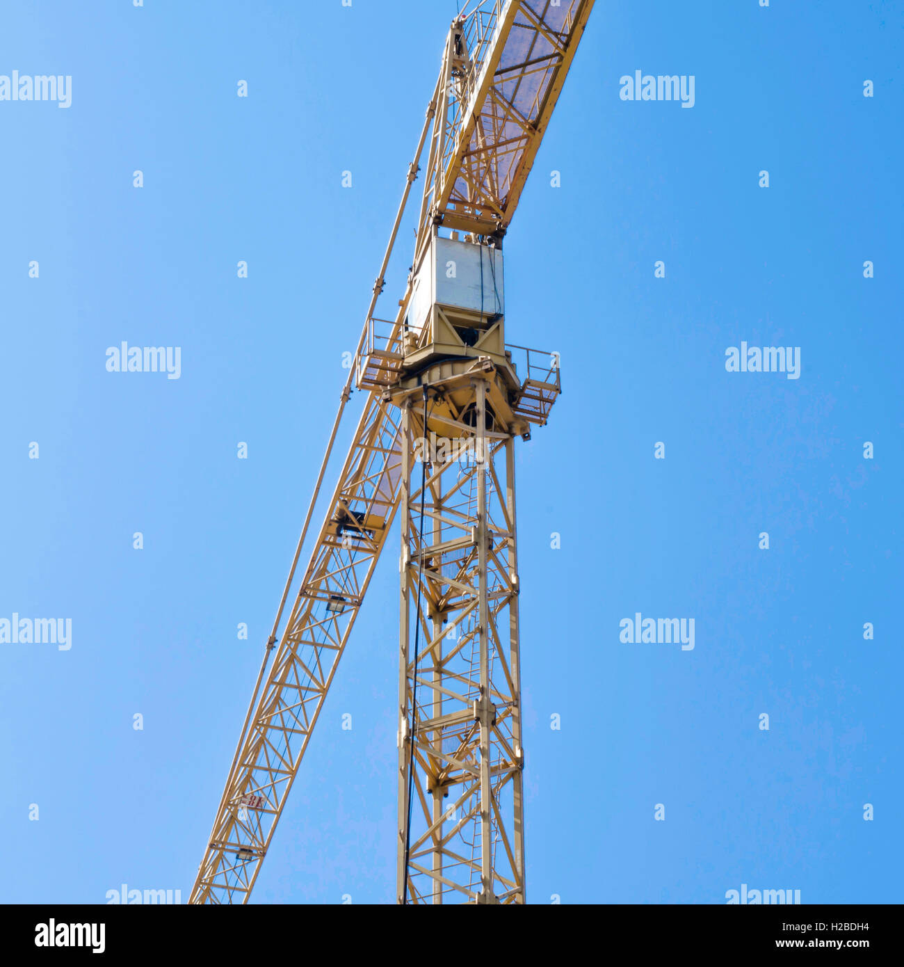 crane on blue sky background Stock Photo - Alamy