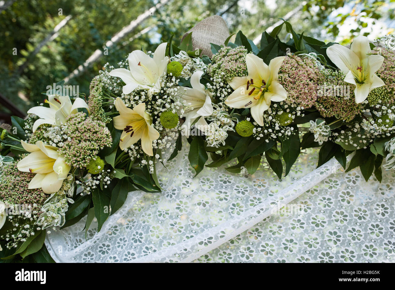 Beautiful wedding arch for marriage decorated with flowers Stock Photo
