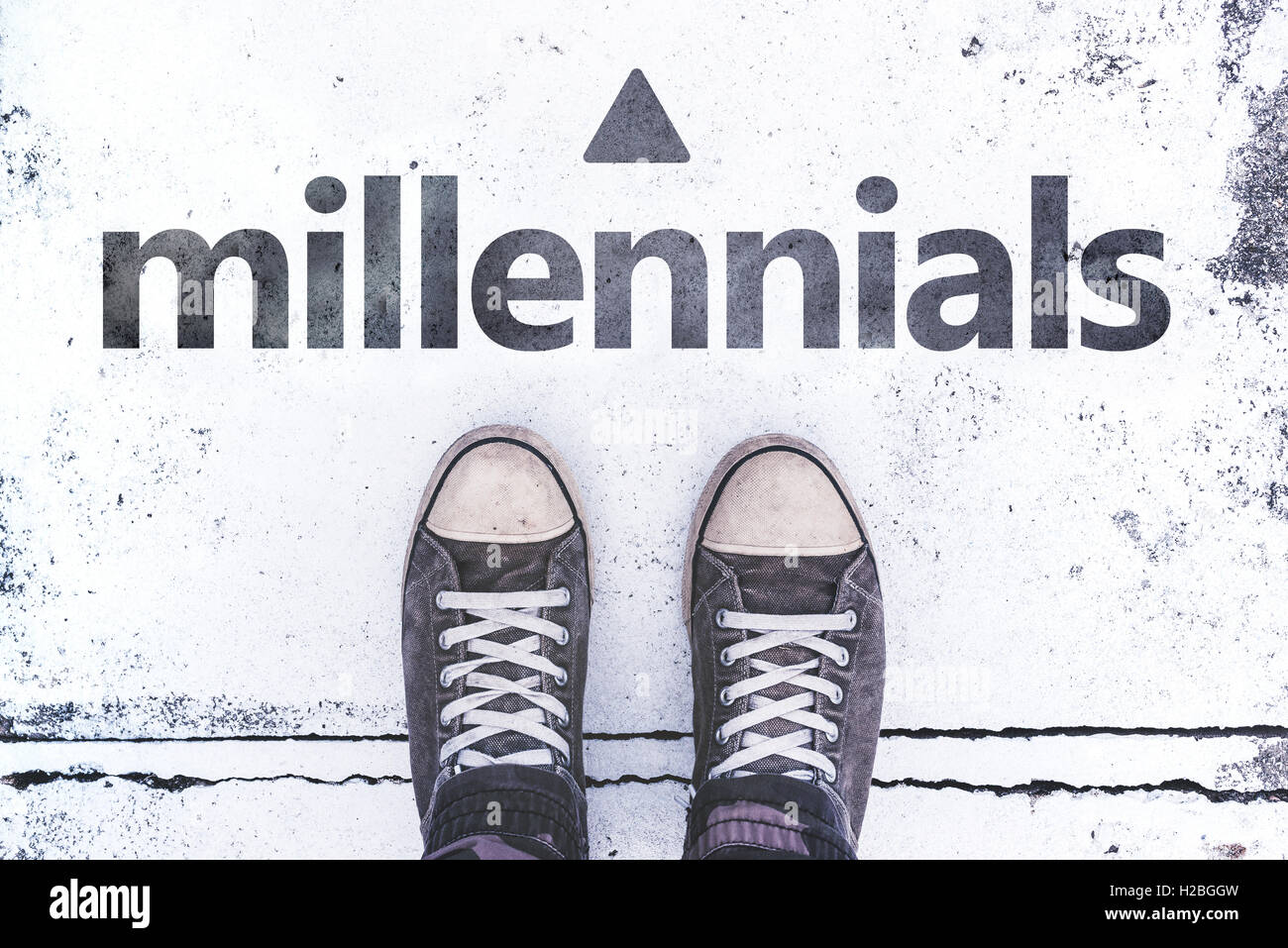 Millennials concept with pair of sneakers on the pavement, casual young generation lifestyle Stock Photo