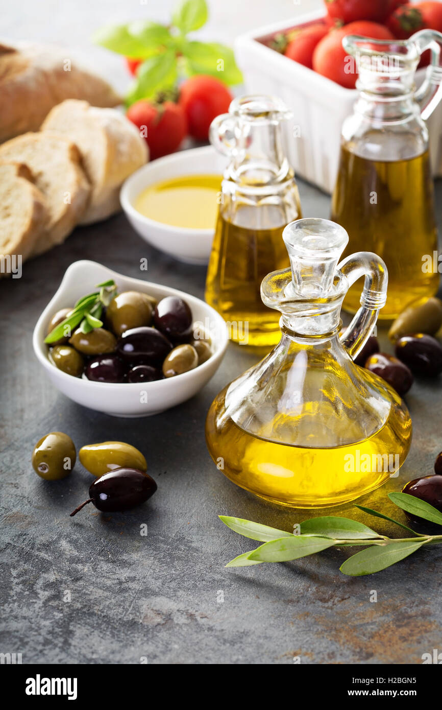 Olive oil in vintage bottles and italian cuisine ingredients Stock ...