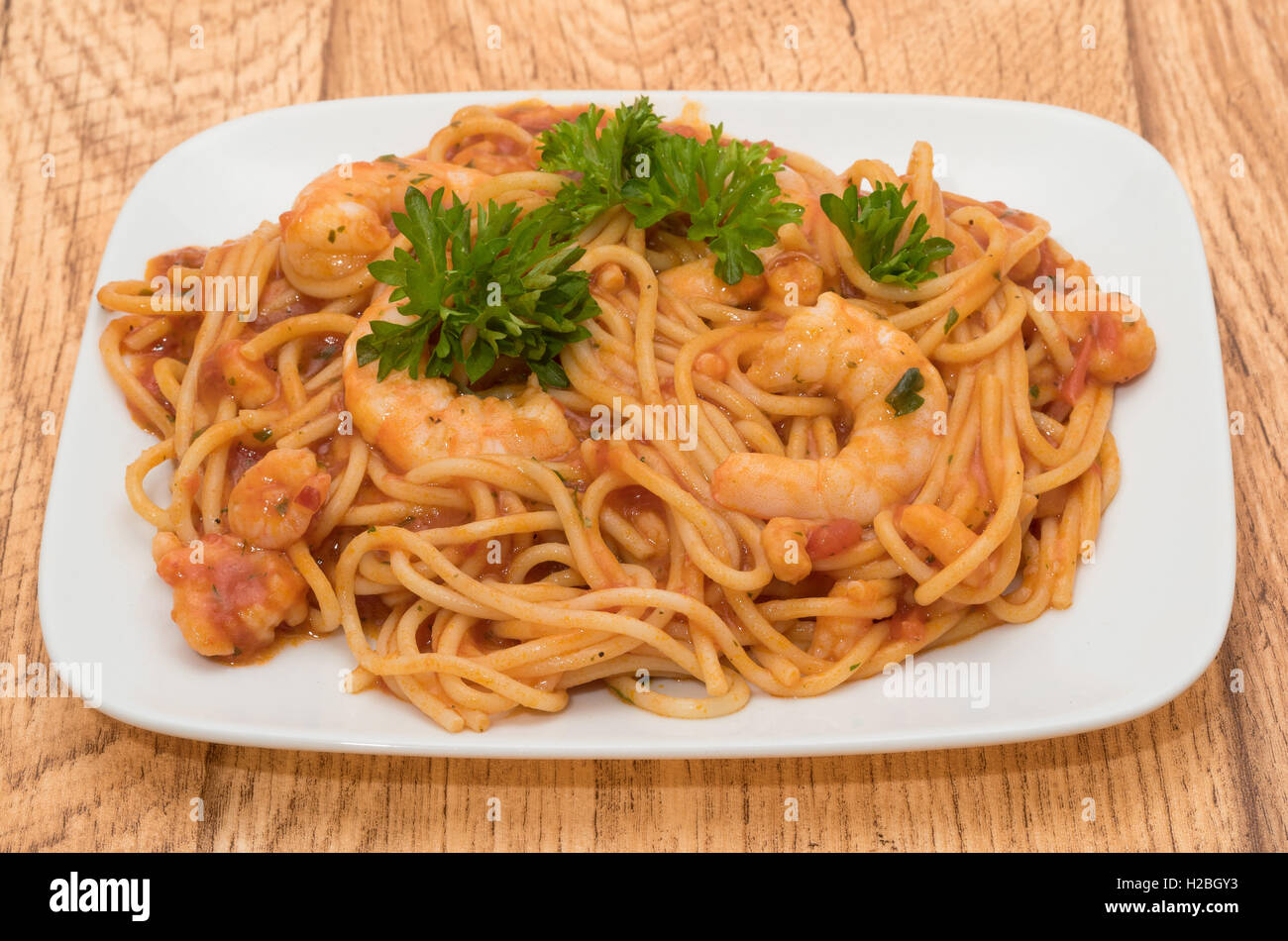Prawns in spaghetti and tomato sauce Stock Photo