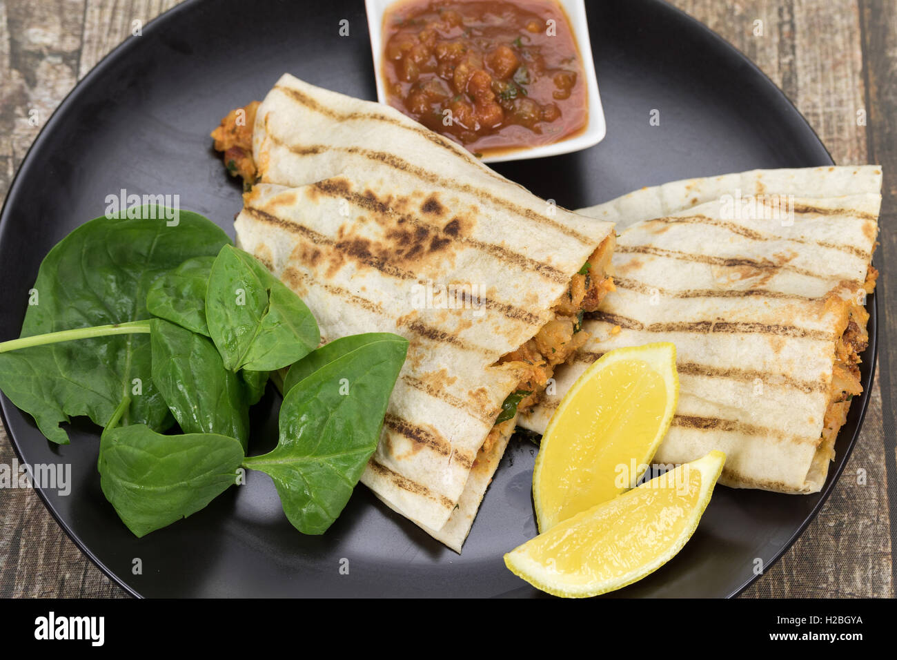 Quesadilla wrap sandwich with chorizo, potato and cheese Stock Photo