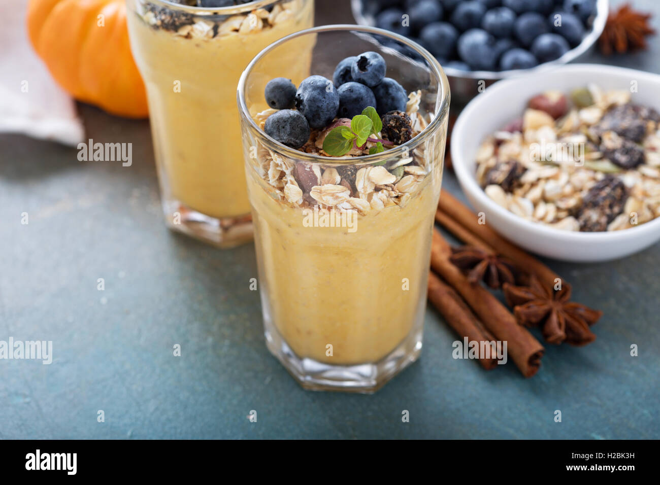 Pumpkin smoothie with granola and berries Stock Photo